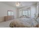 Bright main bedroom with a large window, complemented by a dresser and soft lighting at 14806 E Lookout Ledge --, Fountain Hills, AZ 85268
