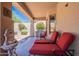 Relaxing covered patio with lounge chairs, grill, and beautiful outdoor fountain at 14806 E Lookout Ledge --, Fountain Hills, AZ 85268