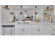 Stylish kitchen with quartz countertops, stainless steel appliances, and open shelving at 15435 N 28Th St # 3, Phoenix, AZ 85032