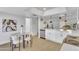 Renovated kitchen with modern appliances, dining table, and an open layout, perfect for entertaining at 15435 N 28Th St # 3, Phoenix, AZ 85032