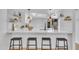 Modern kitchen featuring a breakfast bar with seating and contemporary pendant lighting at 15435 N 28Th St # 3, Phoenix, AZ 85032