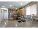 Well-appointed kitchen showcases granite countertops, a stylish backsplash, and modern stainless steel appliances at 17541 W Statler Dr, Surprise, AZ 85388