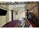 Beautiful main bedroom with a four poster bed, TV, and access to an ensuite bath at 17541 W Statler Dr, Surprise, AZ 85388