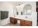 Ensuite bathroom with dual sinks, vanity, and ample counter space at 17753 W Columbine Dr, Surprise, AZ 85388