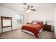 Comfortable bedroom featuring carpet, a ceiling fan, natural light and neutral walls for easy personalization at 17753 W Columbine Dr, Surprise, AZ 85388