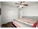 Bedroom featuring wood floors, ceiling fan, large closet, and neutral walls for easy personalization and comfort at 17753 W Columbine Dr, Surprise, AZ 85388