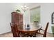 Cozy dining room features a wood table with seating, chandelier and natural light at 17753 W Columbine Dr, Surprise, AZ 85388