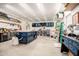 Well-lit garage with ample workspace, custom storage solutions, and modern equipment at 17753 W Columbine Dr, Surprise, AZ 85388