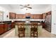 Beautiful kitchen features stainless steel appliances, granite countertops, and island with seating at 17753 W Columbine Dr, Surprise, AZ 85388