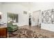Bright living room area featuring tile floors, neutral walls, and lots of natural light at 17753 W Columbine Dr, Surprise, AZ 85388