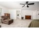 Large main bedroom featuring a ceiling fan, dressers, and access to the ensuite bathroom at 17753 W Columbine Dr, Surprise, AZ 85388