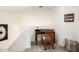 Cozy upstairs study nook with a small desk, chair, and decorative 'love' sign at 17753 W Columbine Dr, Surprise, AZ 85388