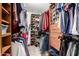 Well-organized walk-in closet featuring custom shelving and ample storage space for clothes, shoes, and accessories at 17753 W Columbine Dr, Surprise, AZ 85388
