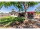 Expansive backyard with lush lawn, covered patio, and outdoor dining area offers an ideal spot for relaxation and recreation at 1953 E Laguna Dr, Tempe, AZ 85282