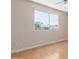 Clean and bright bedroom with large window and laminate floors offer a serene and welcoming atmosphere at 1953 E Laguna Dr, Tempe, AZ 85282