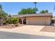 Lovely single-story home with low-maintenance landscaping, mature trees, and a wide driveway at 1953 E Laguna Dr, Tempe, AZ 85282