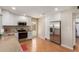Bright kitchen featuring stainless steel appliances, ample storage, and a convenient door to the backyard at 1953 E Laguna Dr, Tempe, AZ 85282
