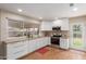 Modern kitchen featuring sleek white cabinets, stainless steel appliances, and a bright, airy feel at 1953 E Laguna Dr, Tempe, AZ 85282