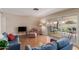 Comfortable living room with hardwood floors, sliding glass doors to the patio, and ample seating at 1953 E Laguna Dr, Tempe, AZ 85282