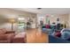 Bright living room featuring hardwood floors, comfortable seating, and an open floor plan at 1953 E Laguna Dr, Tempe, AZ 85282