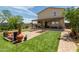 Backyard boasts artificial turf, brick pavers, covered patio perfect for outdoor gatherings at 198 E Patton Ave, Coolidge, AZ 85128