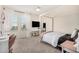 Bright bedroom with a four-poster bed, a modern desk, and large windows offering ample natural light at 198 E Patton Ave, Coolidge, AZ 85128