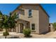 Two-story home features a well-maintained exterior with desert landscaping and an inviting entrance at 198 E Patton Ave, Coolidge, AZ 85128