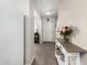 Inviting hallway featuring hardwood floors, neutral wall colors, and decorative accents, creating a welcoming entry at 198 E Patton Ave, Coolidge, AZ 85128