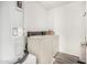 Functional laundry room equipped with a washer, dryer, and water heater, offering convenience for daily chores at 198 E Patton Ave, Coolidge, AZ 85128