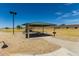 Community park featuring a shaded picnic area with a grill and grassy open space, perfect for outdoor recreation at 198 E Patton Ave, Coolidge, AZ 85128