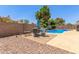 Backyard featuring patio area and furniture, mature trees, privacy wall and pool at 2031 W Gila Ln, Chandler, AZ 85224
