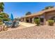 Backyard featuring mature trees, privacy wall, desert landscaping, outdoor furniture, and a pool at 2031 W Gila Ln, Chandler, AZ 85224