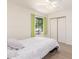 Comfortable bedroom with a ceiling fan, closet, and window with lush green curtains at 2031 W Gila Ln, Chandler, AZ 85224