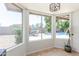 Bright dining area with large windows offering views of the pool and lush backyard landscaping at 2031 W Gila Ln, Chandler, AZ 85224