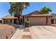 Charming single-story home with well-maintained landscaping and a two-car garage at 2031 W Gila Ln, Chandler, AZ 85224