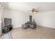Comfortable living room with wood-look tile flooring, ceiling fan, and gray sofa set at 2031 W Gila Ln, Chandler, AZ 85224