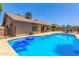 Backyard featuring a private pool, patio area, and mature landscaping at 2031 W Gila Ln, Chandler, AZ 85224