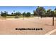 Community sand volleyball court with net in a well maintained park setting at 2031 W Gila Ln, Chandler, AZ 85224