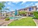 Inviting backyard featuring a refreshing pool, lush greenery, and a charming patio area perfect for outdoor entertaining at 21167 E Aspen Valley Dr, Queen Creek, AZ 85142