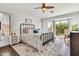 Primary bedroom offers dark hardwood floors, large windows and a walkout balcony at 21167 E Aspen Valley Dr, Queen Creek, AZ 85142