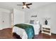 Serene bedroom featuring hardwood floors, a comfortable bed, and a calming color palette for a relaxing retreat at 21167 E Aspen Valley Dr, Queen Creek, AZ 85142