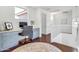 Hallway with a built-in desk and drawers, along with an upholstered office chair at 21167 E Aspen Valley Dr, Queen Creek, AZ 85142