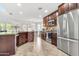 Modern kitchen with stainless steel appliances, dark wood cabinetry, and an open layout perfect for entertaining at 21167 E Aspen Valley Dr, Queen Creek, AZ 85142