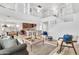 Spacious living room featuring a soaring two-story ceiling, open floor plan, and an abundance of natural light at 21167 E Aspen Valley Dr, Queen Creek, AZ 85142