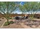 Charming backyard retreat featuring a seating area and brick pavers, perfect for relaxing or entertaining at 21934 E Lords Ct, Queen Creek, AZ 85142