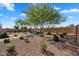 Well-maintained backyard with desert landscaping and a comfortable seating area, offering a private outdoor space at 21934 E Lords Ct, Queen Creek, AZ 85142