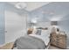 Comfortable bedroom with creative wallpaper, matching bedside tables, and double closets at 21934 E Lords Ct, Queen Creek, AZ 85142