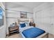 Cozy bedroom featuring a nautical theme, soft blue bedding, and natural light from the window at 21934 E Lords Ct, Queen Creek, AZ 85142