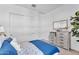 Bright bedroom featuring nautical-themed decor, including wooden oars, and clean white walls at 21934 E Lords Ct, Queen Creek, AZ 85142