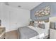 Comfortable bedroom features modern decor, neutral tones, stylish bedding, and complementary bedside tables at 21934 E Lords Ct, Queen Creek, AZ 85142